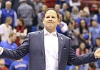 Newly-hired Kansas football coach Les Miles greets the Allen Fieldhouse crowd during halftime of the Jayhawks’ game against Stanford on Dec. 1, 2018. 