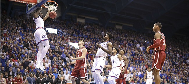 Kansas guard Marcus Garrett (0) comes down with a dunk against Oklahoma during the first half, Wednesday, Jan. 2, 2019 at Allen Fieldhouse.