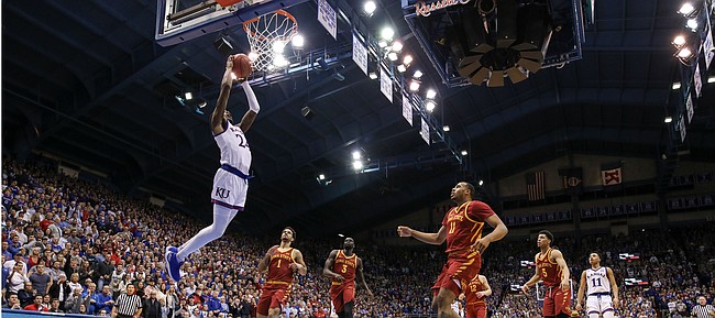 Kansas guard Lagerald Vick (24) gets up for a lob jam to get the Jayhawks fired up during the second half, Monday, Jan. 21, 2019 at Allen Fieldhouse.