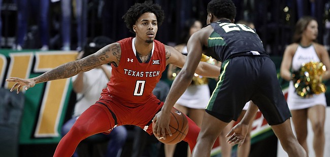 Texas Tech 's Kyler Edwards (0) defends as Baylor's Jared Butler handles the ball during an NCAA college basketball game, Saturday, Jan. 19, 2019, in Waco, Texas. 
