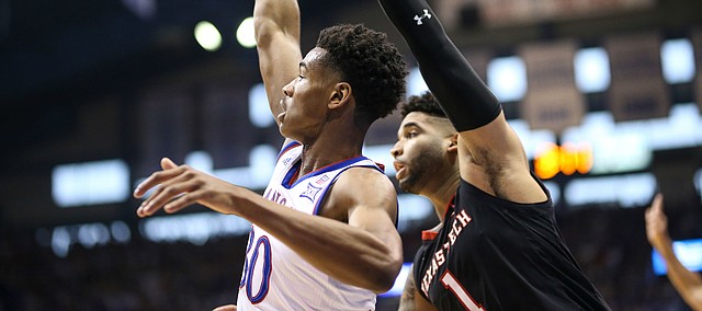 Kansas guard Ochai Agbaji (30) hangs his hand after putting up a three during the first half, Saturday, Feb. 2, 2019 at Allen Fieldhouse.