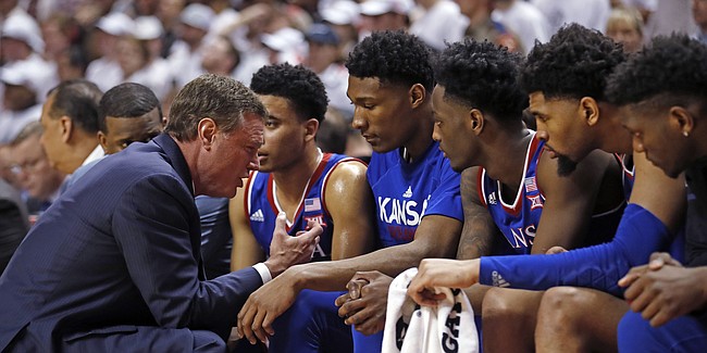 Kansas coach Bill Self talks to his players on the bench during the second half of the team's NCAA college basketball game against Texas Tech, Saturday, Feb. 23, 2019, in Lubbock, Texas. (AP Photo/Brad Tollefson)