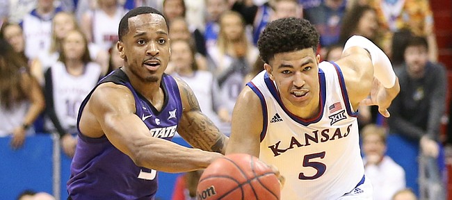 Kansas guard Quentin Grimes (5) and Kansas State guard Barry Brown Jr. (5) run down a loose ball during the second half, Monday, Feb. 25, 2019 at Allen Fieldhouse.