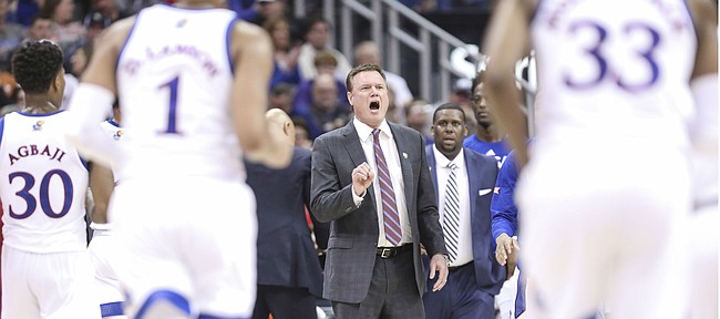 Kansas head coach Bill Self pulls his team in during a timeout in the first half, Thursday, March 14, 2019 at Sprint Center in Kansas City, Mo.