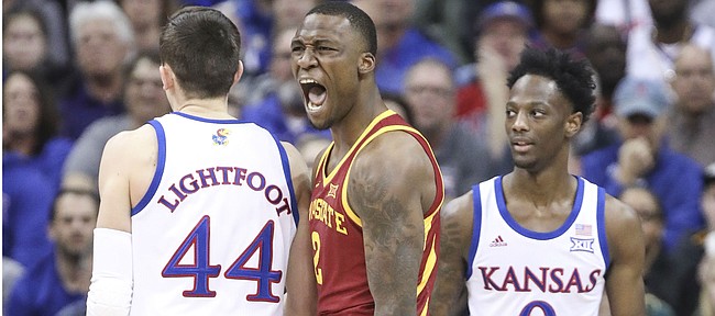 Iowa State forward Cameron Lard (2) roars after a bucket and a foul by Kansas guard Marcus Garrett (0) during the first half, Saturday, March 16, 2019 at Sprint Center in Kansas City, Mo.
