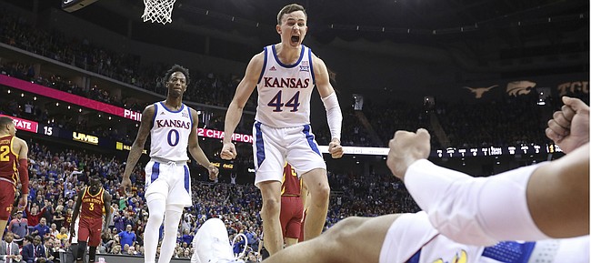 Kansas forward Mitch Lightfoot (44) celebrates after a bucket and an Iowa State foul on Kansas guard Quentin Grimes (5) during the first half, Saturday, March 16, 2019 at Sprint Center in Kansas City, Mo.