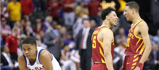 Kansas guard Charlie Moore (2) waits out a couple of free throws as Iowa State guard Lindell Wigginton (5) and Iowa State guard Tyrese Haliburton (22) celebrate with less than a minute to play in the game, Saturday, March 16, 2019 at Sprint Center in Kansas City, Mo.