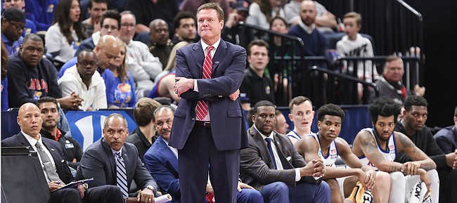 Kansas head coach Bill Self and the bench watch in silence during the first half on Saturday, March 23, 2019 at Vivint Smart Homes Arena in Salt Lake City, Utah.