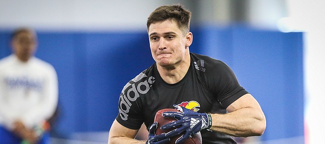 Former Kansas receiver Ryan Schadler sprints up the field after pulling in a pass during Pro Day on Wednesday, March 27, 2019 at the Kansas Football Indoor Practice Facility.