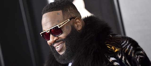 FILE — Rick Ross arrives at the 60th annual Grammy Awards at Madison Square Garden on Sunday, Jan. 28, 2018, in New York. The Grammy-nominated rapper will perform April 13 at the Kansas football team's spring game. (Photo by Evan Agostini/Invision/AP)