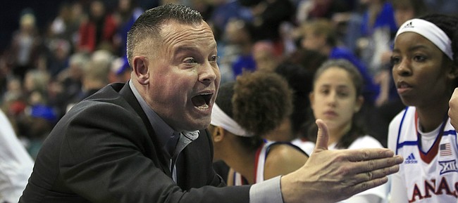Kansas head coach Brandon Schneider talks to his team during the first half of an NCAA college basketball game against Baylor in Lawrence, Kan., Wednesday, Jan. 16, 2019. (AP Photo/Orlin Wagner)