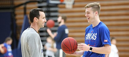 Kansas walk on Michael Jankovich, son of former KU assistant Tim Jankovich, who is the current head coach at SMU, laughs with Wasbhurn head basketball coach Brett Ballard during a Washburn University basketball camp on Tuesday, June 4, 2019 at Lee Arena in Topeka.