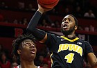 Iowa guard Isaiah Moss (4) shoots over Rutgers forward Shaq Carter (13) during the first half of an NCAA college basketball game Saturday, Feb. 16, 2019, in Piscataway, N.J.

