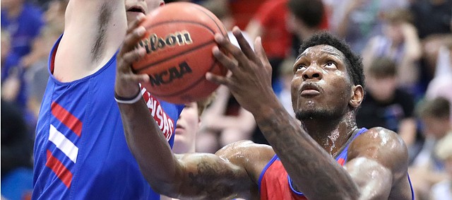 Kansas forward Silvio De Sousa gets to the bucket against Kansas forward Mitch Lightfoot during a scrimmage on Tuesday, June 11, 2019 at Allen Fieldhouse.