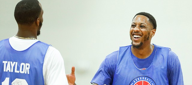 Blue Team guards Mario Chalmers and Tyshawn Taylor have a laugh during the Rock Chalk Roundball Classic on Thursday, June 20, 2019 at Eudora High School.