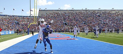 Kansas wide receiver Jeremiah Booker (88) catches a touchdown pass before Rutgers linebacker Tyreek Maddox-Williams (44) during the first quarter on Saturday, Sept. 15, 2018 at Memorial Stadium.