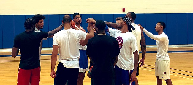 The Self Made squad comes together to finish off practice on Monday, July 22, 2019, at the KU practice gym. 
