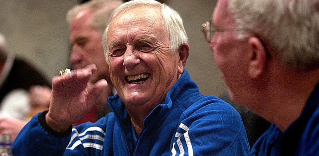 Kansas University announcer Max Falkenstien laughs during a conversation with radio cohort Bob Davis, right. Falkenstien, shown Jan. 4 in Allen Fieldhouse before KU's game against Yale, will broadcast his final game in the venerable building tonight.