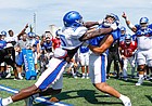Kansas linebacker Azur Kamara (5) goes head-to-head with tight end Jack Luavasa in the Jayhawk drill during practice on Friday, Aug. 9, 2019.