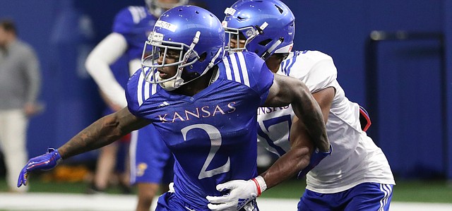 Kansas receiver Daylon Charlot breaks free from a defender on Thursday, April 4, 2019 at the indoor practice facility.