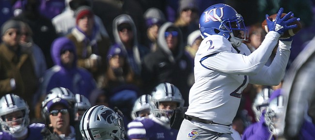Kansas wide receiver Daylon Charlot (2) gets up for a catch near the sideline as he is covered by Kansas State defensive back AJ Parker (12) during the third quarter on Saturday, Nov. 10, 2018 at Bill Snyder Family Stadium in Manhattan, Kan.