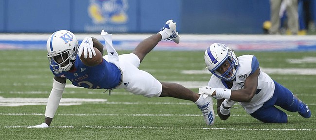 Kansas wide receiver Daylon Charlot reaches out for a first down Saturday afternoon at David Booth Kansas Memorial Stadium on Aug. 31, 2019.