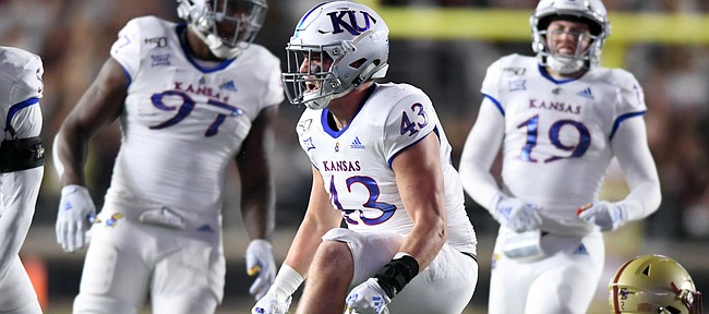 (Boston, MA, 09/13/19) Kansas Jayhawks linebacker Jay Dineen (43) celebrates after stopping Boston College Eagles running back AJ Dillon (2) during the first half of an NCAA football game at Boston College in Boston, Mass., on Friday, September 13, 2019.