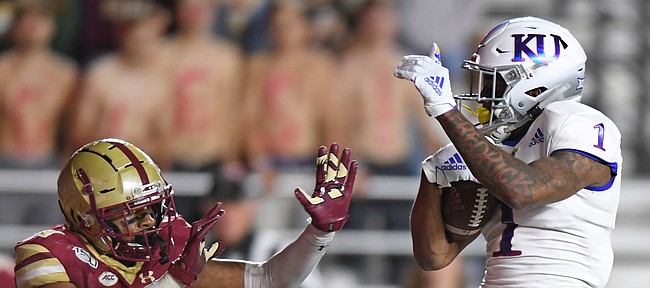 (Boston, MA, 09/13/19) Kansas Jayhawks running back Pooka Williams Jr. (1) scores a touchdown over Boston College Eagles defensive back Mehdi El Attrach (25) during the third quarter of an NCAA football game at Boston College in Boston, Mass., on Friday, September 13, 2019.