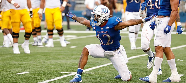 Kansas safety Jeremiah McCullough (12) celebrates after breaking up a pass deep in the Jayhawks' territory during the fourth quarter on Saturday, Sept. 21, 2019 at David Booth Kansas Memorial Stadium.