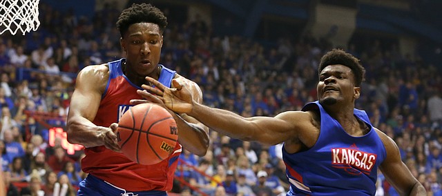 Kansas forward David McCormack (33) and Kansas center Udoka Azubuike (35) battle for a ball during Late Night in the Phog on Friday, Oct. 4, 2019 at Allen Fieldhouse.