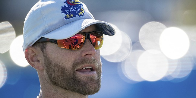 New Kansas offensive coordinator Brent Dearmon surveys the action during a recent KU football practice. Dearmon was promoted from offensive consultant to O.C. on Sunday, Oct. 6, 2019, and is the process of preparing for his first game in his new role. 
