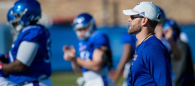 New Kansas offensive coordinator Brent Dearmon watches a play during a recent KU football practice. Dearmon was promoted from offensive consultant to O.C. on Sunday, Oct. 6, 2019, and is the process of preparing for his first game in his new role. 