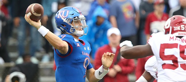 Kansas quarterback Carter Stanley (9) throws to a receiver during the first quarter on Saturday, Oct. 5, 2019 at Memorial Stadium.