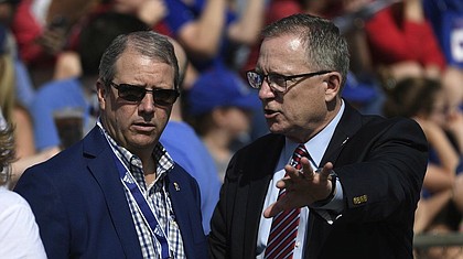 Kansas chancellor Doug Girod and Athletics Director Jeff Long talk before the game Saturday afternoon at David Booth Kansas Memorial Stadium on Aug. 31, 2019.