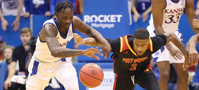 Kansas guard Marcus Garrett (0) steals the ball from Pittsburg State guard Jah-Kobe Womack (3) during the first half, Thursday, Oct. 31, 2019 at Allen Fieldhouse.

