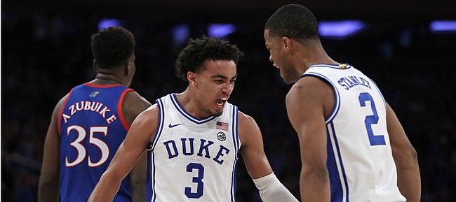 Duke guard Tre Jones (3) and guard Cassius Stanley (2) react after a basket during the second half of the team's NCAA college basketball game against Kansas on Tuesday, Nov. 5, 2019, in New York. (AP Photo/Adam Hunger)