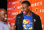 Booker T. Washington basketball player Bryce Thompson, right, celebrates with former coach Joe Redmond after announcing his signing with the University of Kansas in Tulsa, Okla., on Tuesday, November 12, 2019.