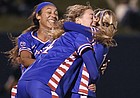 Kailey Lane (center), Sam Barnett (left), and Katie McClure (right) celebrate a goal by Lane against Iowa Saturday night at Rock Chalk Park on Nov. 16, 2019.