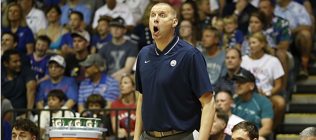BYU head coach Mark Pope reacts to play as his team takes on Kansas during the first half of an NCAA college basketball game Tuesday, Nov. 26, 2019, in Lahaina, Hawaii. (AP Photo/Marco Garcia)
