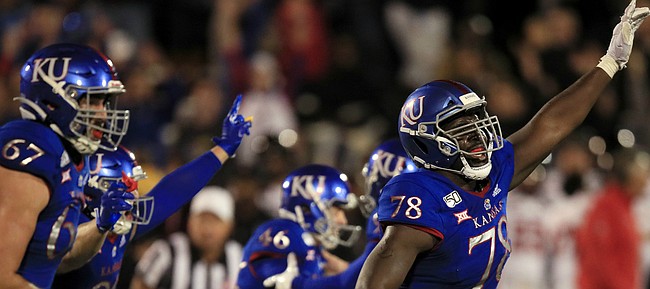 Kansas offensive lineman Hakeem Adeniji (78) celebrates a game-winning field goal at the end of an NCAA college football game against Texas Tech in Lawrence, Kan., Saturday, Oct. 26, 2019. Kansas defeated Texas Tech 37-34. (AP Photo/Orlin Wagner)