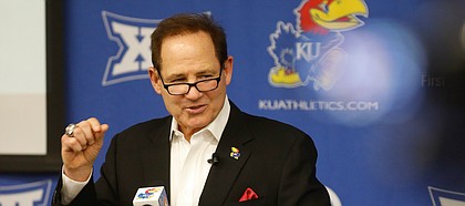 Kansas head football coach Les Miles talks with media members during a signing day press conference on Wednesday, Dec. 18, 2019 in Mrkonic Auditorium.
