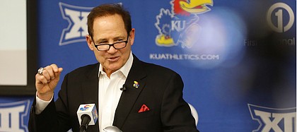 Kansas head football coach Les Miles talks with media members during a signing day press conference on Wednesday, Dec. 18, 2019 in Mrkonic Auditorium.