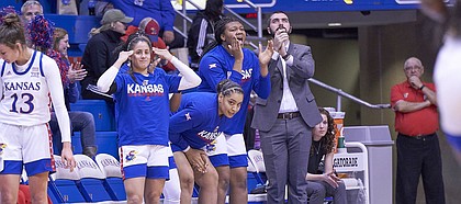 The Kansas bench celebrates a 3-pointer in the second quarter during KU's nonconference finale Monday night at Allen Fieldhouse on Dec. 30, 2019.