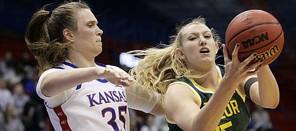 Baylor forward Lauren Cox (15) pulls in a rebound next to Kansas center Bailey Helgren (35) during the second half of an NCAA college basketball game in Lawrence, Kan., Wednesday, Jan. 15, 2020. (AP Photo/Orlin Wagner)