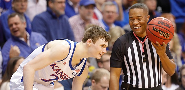 Kansas guard Christian Braun (2) laughs with a game official during the second half, Tuesday, Jan. 21, 2020 at Allen Fieldhouse.