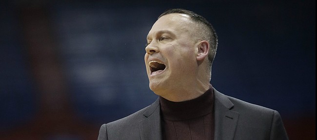 Kansas coach Brandon Schneider yells to his team during the first half of an NCAA college basketball game against Baylor in Lawrence, Kan., on Wednesday, Jan. 15, 2020. 


