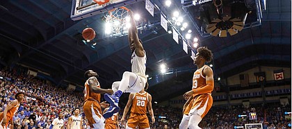 Kansas center Udoka Azubuike (35) throws down a dunk against Texas guard Courtney Ramey (3) during the second half on Monday, Feb. 3, 2020 at Allen Fieldhouse.