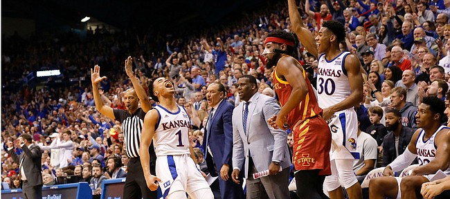 Kansas guard Devon Dotson (1) erupts after hitting a three-pointer in front of Iowa State guard Tre Jackson (3) during the second half on Monday, Feb. 17, 2020 at Allen Fieldhouse.