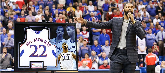 Kansas great Marcus Morris addresses the Fieldhouse crowd during a halftime ceremony in which his jersey was retired.