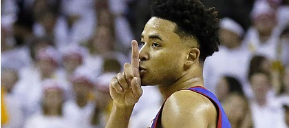 Kansas guard Devon Dotson gestures to the crowd after a three point basket against Baylor during the first half of an NCAA college basketball game on Saturday, Feb. 22, 2020, in Waco, Texas. (AP Photo/Ray Carlin)